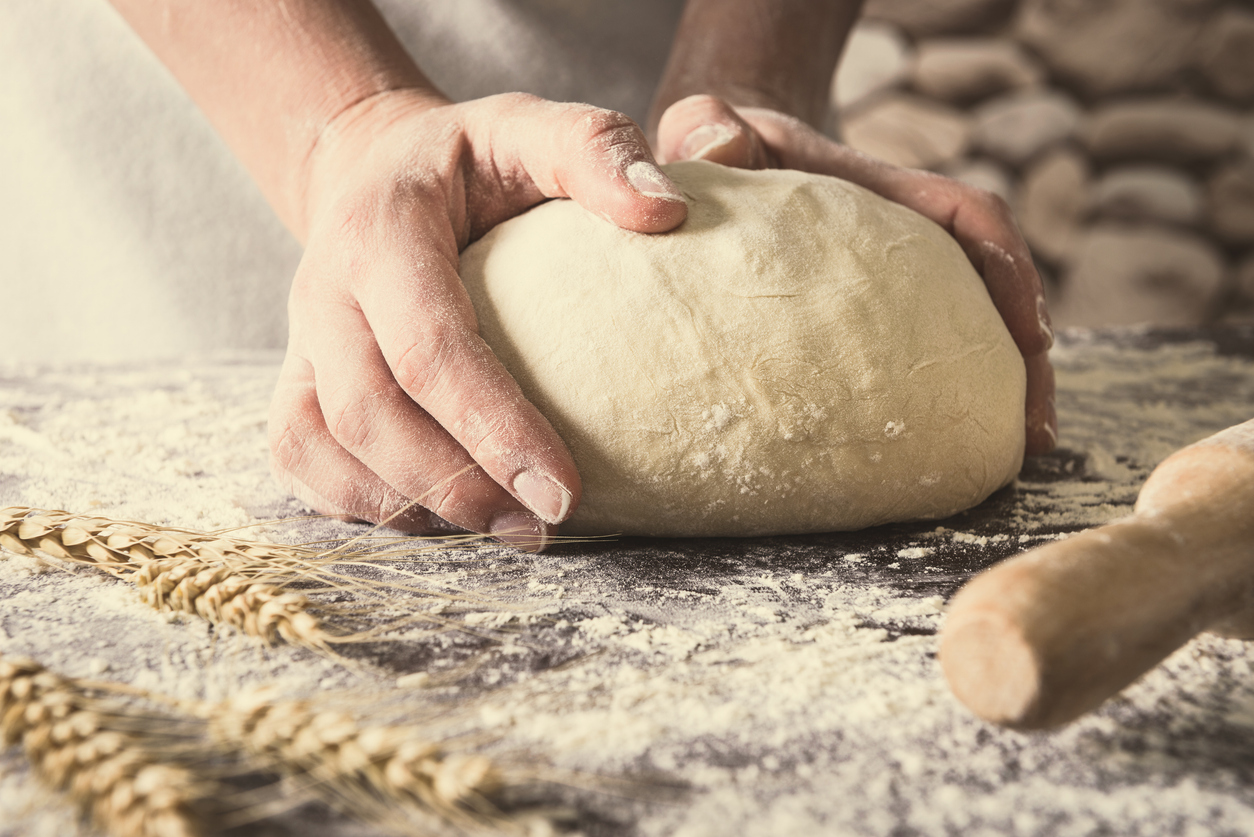 Bread dough being kneaded